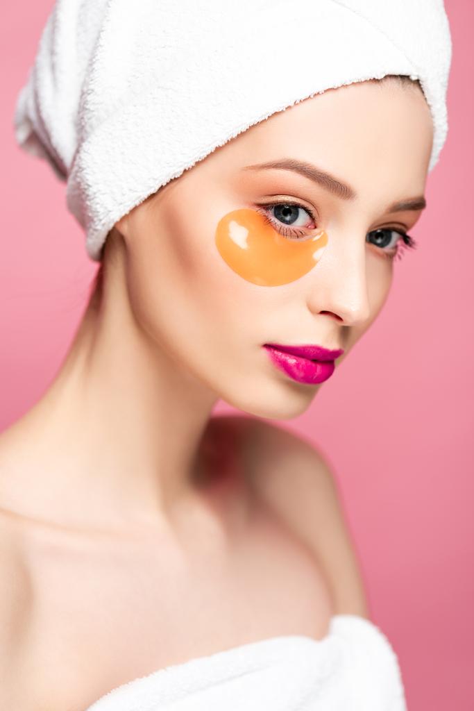 beautiful woman in eye patch and white towel isolated on pink  - Photo, Image