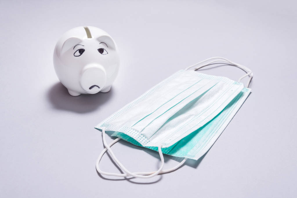 Sad piggy bank and set of Medical disposable masks - Photo, Image