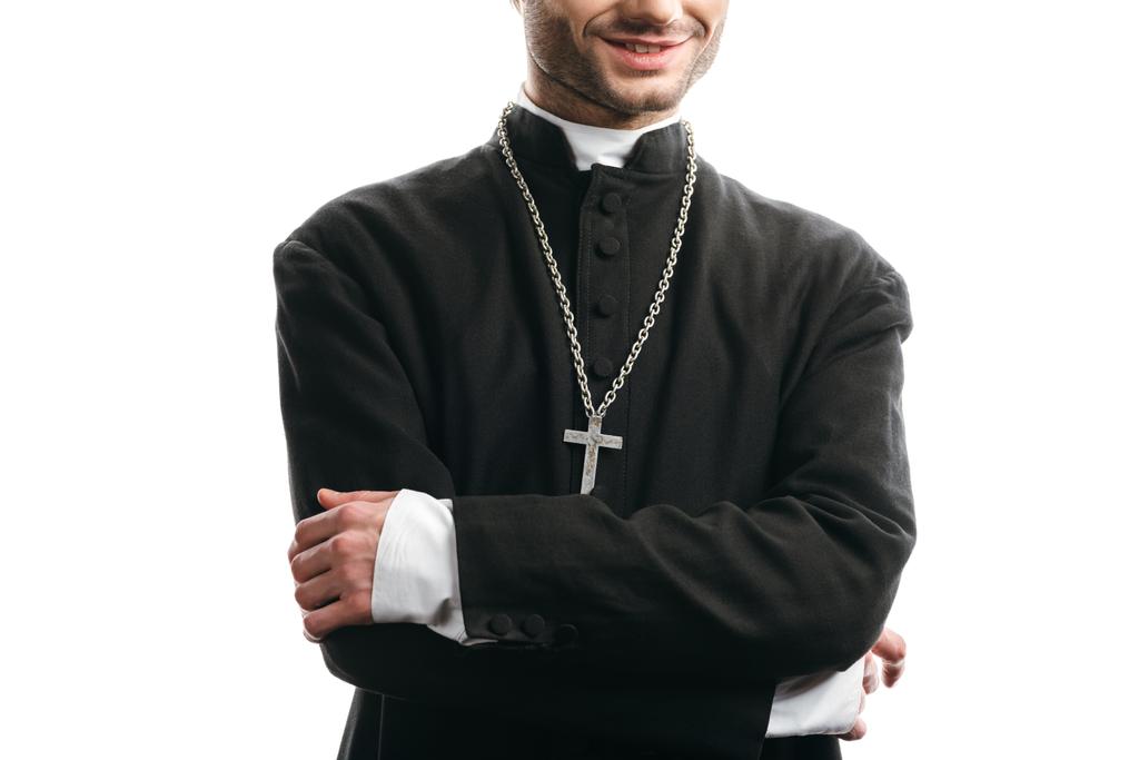 levágott kilátás mosolygós katolikus pap álló keresztbe karok elszigetelt fehér - Fotó, kép