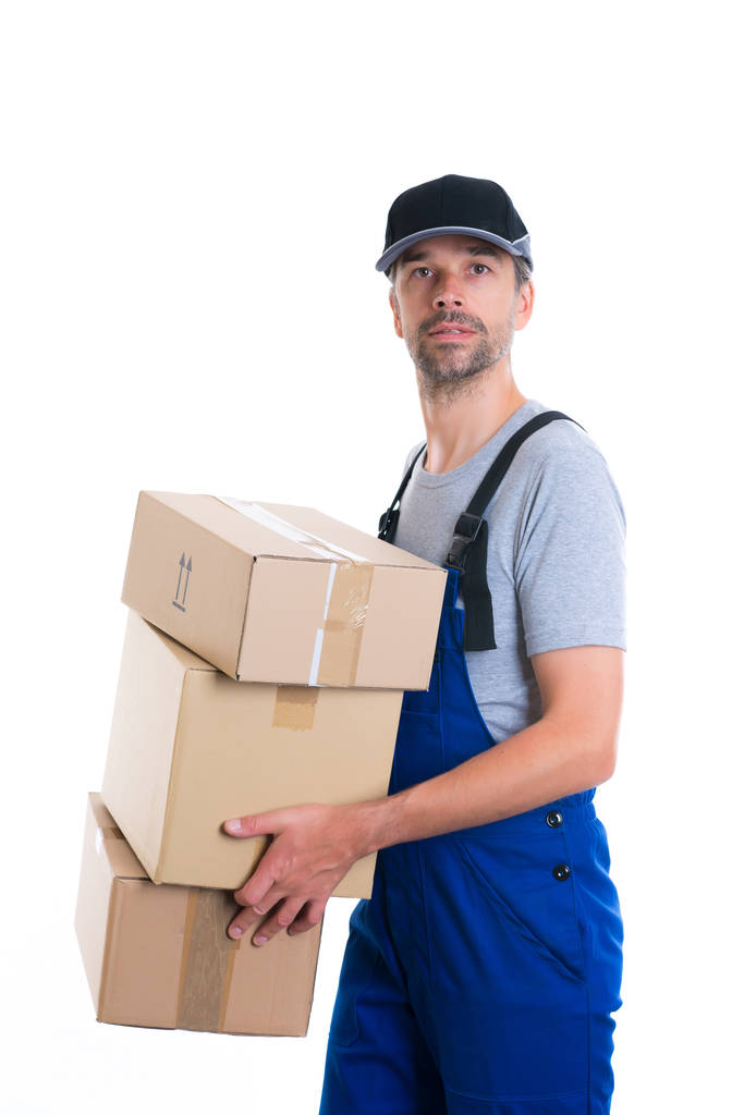 friendly postman with parcels in front of white background - Foto, Bild