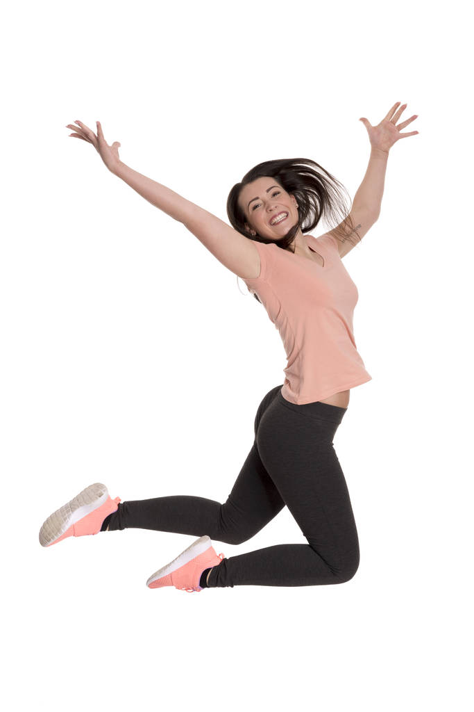 jonge vrouw doet een sprong van vreugde - Foto, afbeelding
