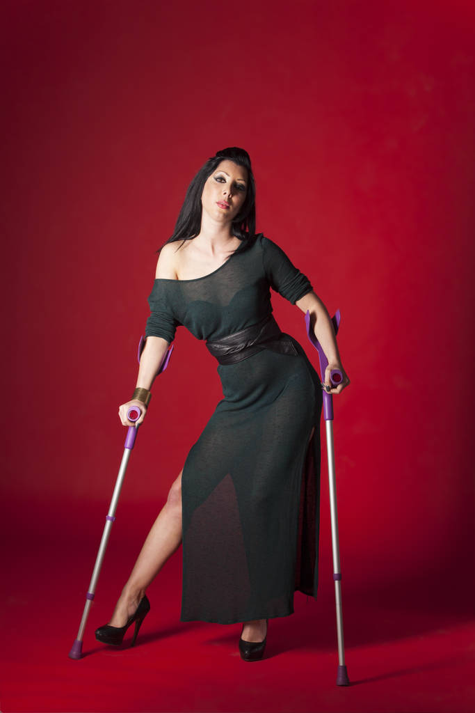 woman in an evening dress on crutches - Photo, Image