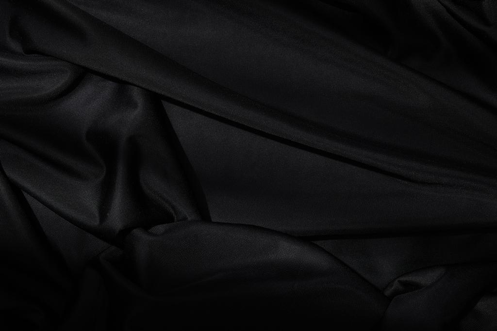 Siyah tekstil arkaplanının üst görünümü - Fotoğraf, Görsel