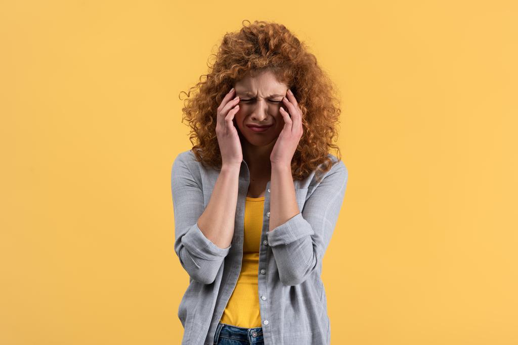 beautiful redhead upset girl crying isolated on yellow - Photo, Image
