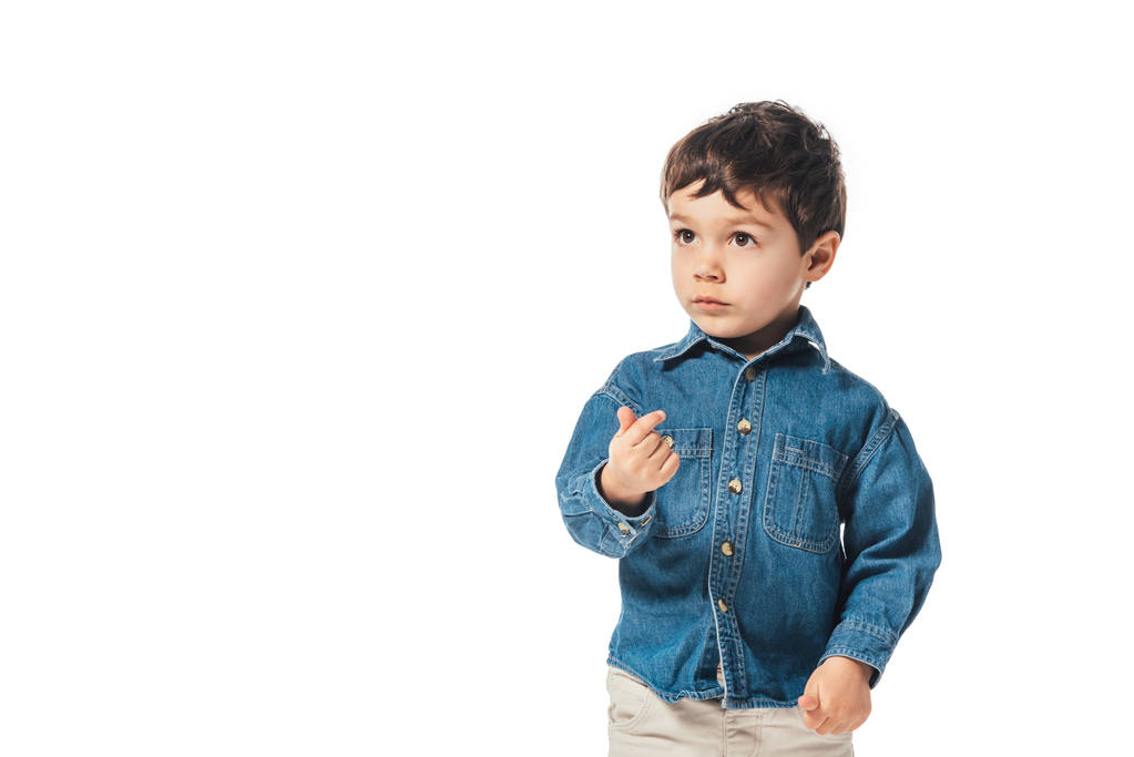 adorable chico en camisa de mezclilla mirando hacia otro lado aislado en blanco
  - Foto, imagen
