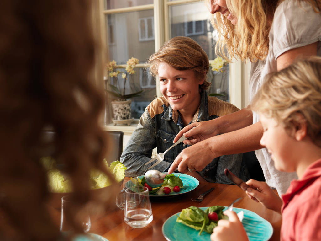 Mother serving healthy meal to family - Photo, Image