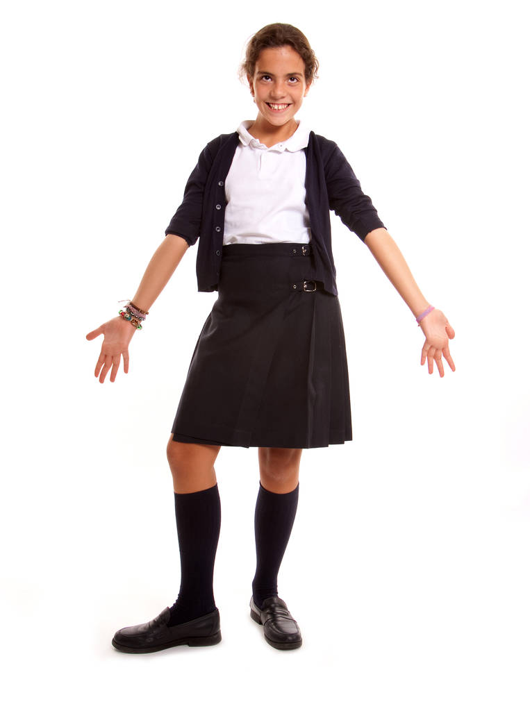 Gelukkig schoolmeisje met de typische uniform - Foto, afbeelding