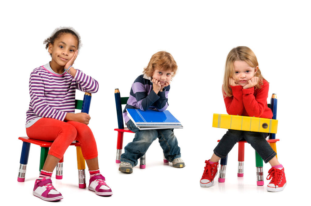 Young students seated in a chair isolated in white - Photo, Image