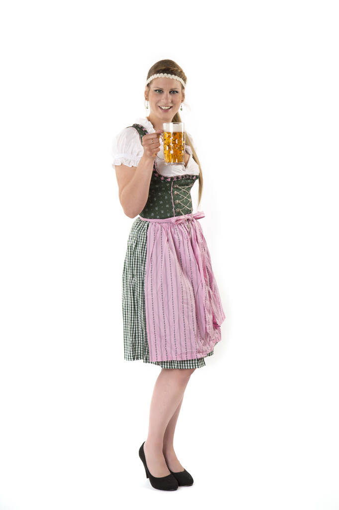 beautiful oktoberfest girl in dirndl holding a tray of beer - Photo, Image