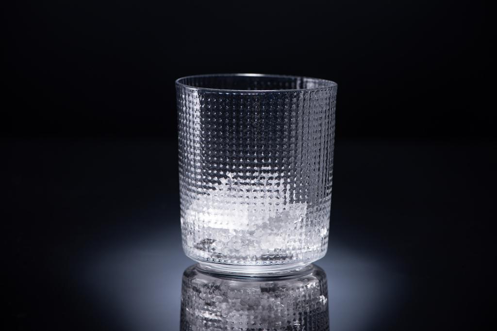 faceted glass with ice on black background - Photo, Image