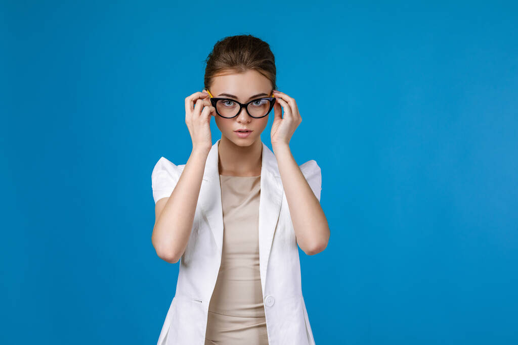 Portrait of young business woman wearing glasses - Photo, Image