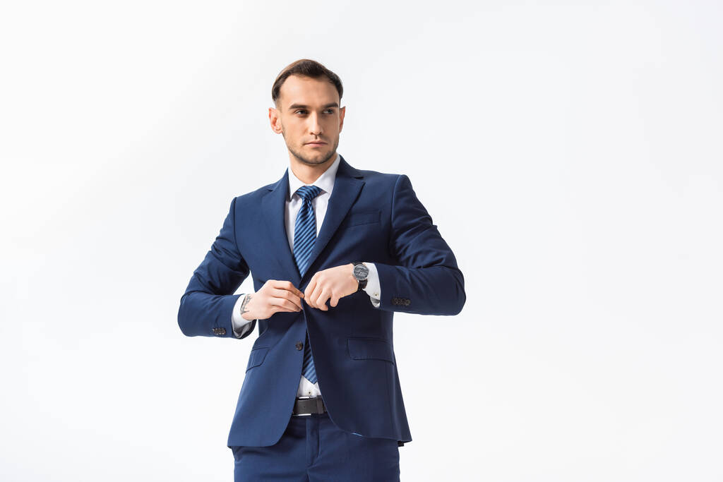 erfolgreicher junger Geschäftsmann im blauen Anzug isoliert auf weißem Grund - Foto, Bild