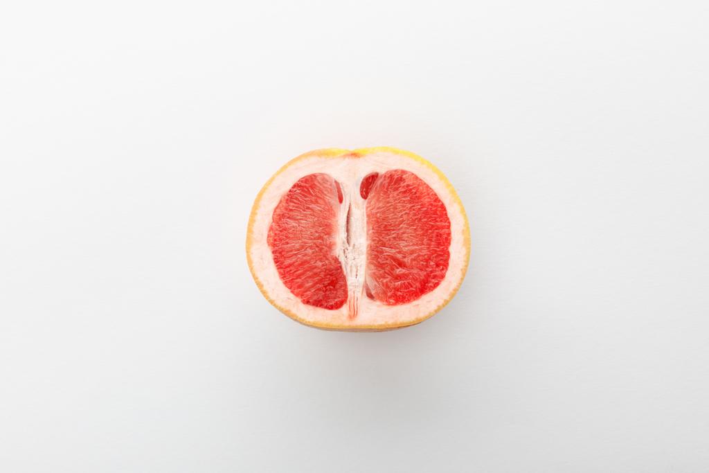 Top view of grapefruit half on white background - Photo, Image