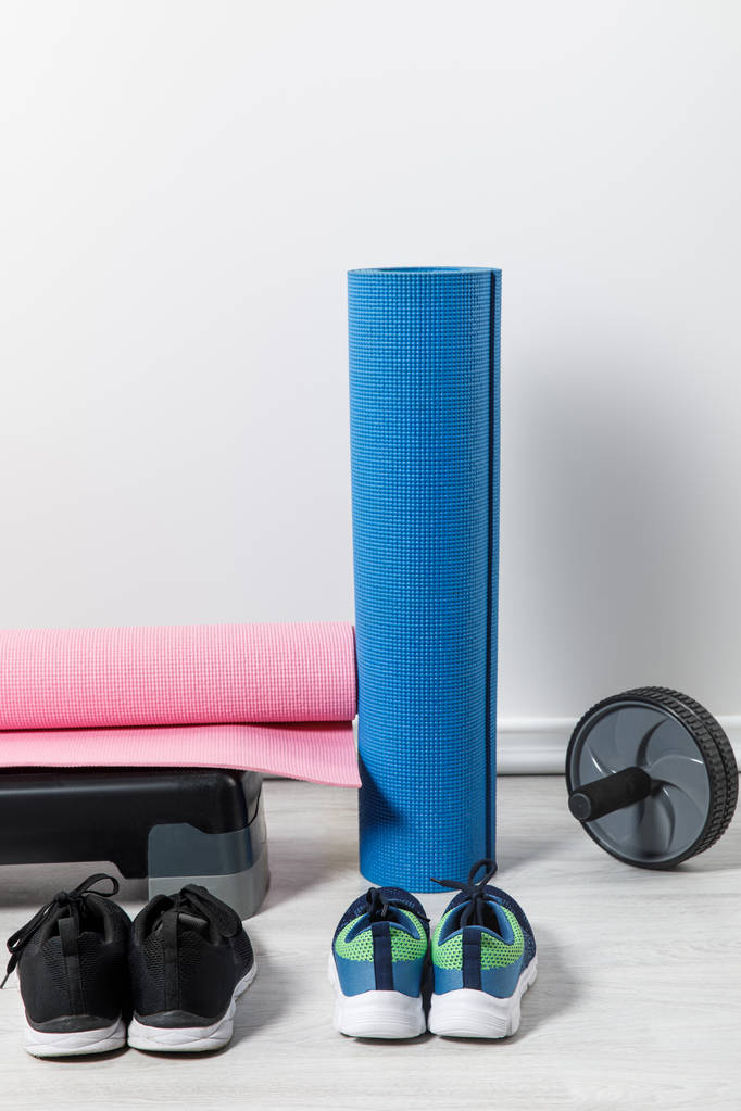 step platform, fitness mats and sport equipment on floor at home  - Photo, Image