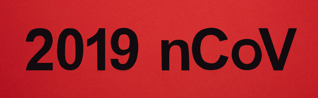 Top view of 019 ncov lettering isolated on red, panoramic shot - Photo, Image