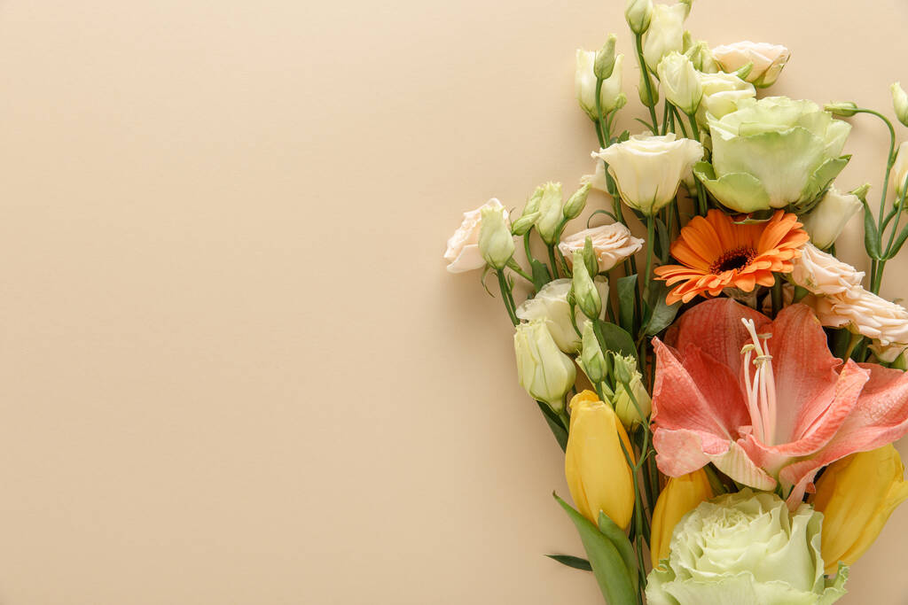 top view of spring floral bouquet on beige background - Photo, Image