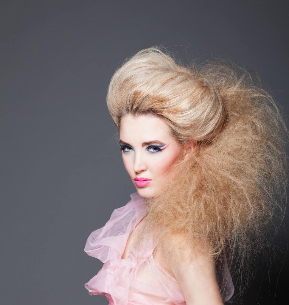 Beautiful model the blonde with a creative hairdress and a make-up - Photo, Image