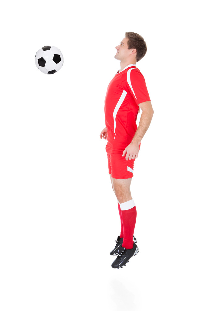 Joueur de football jouant avec le football
 - Photo, image