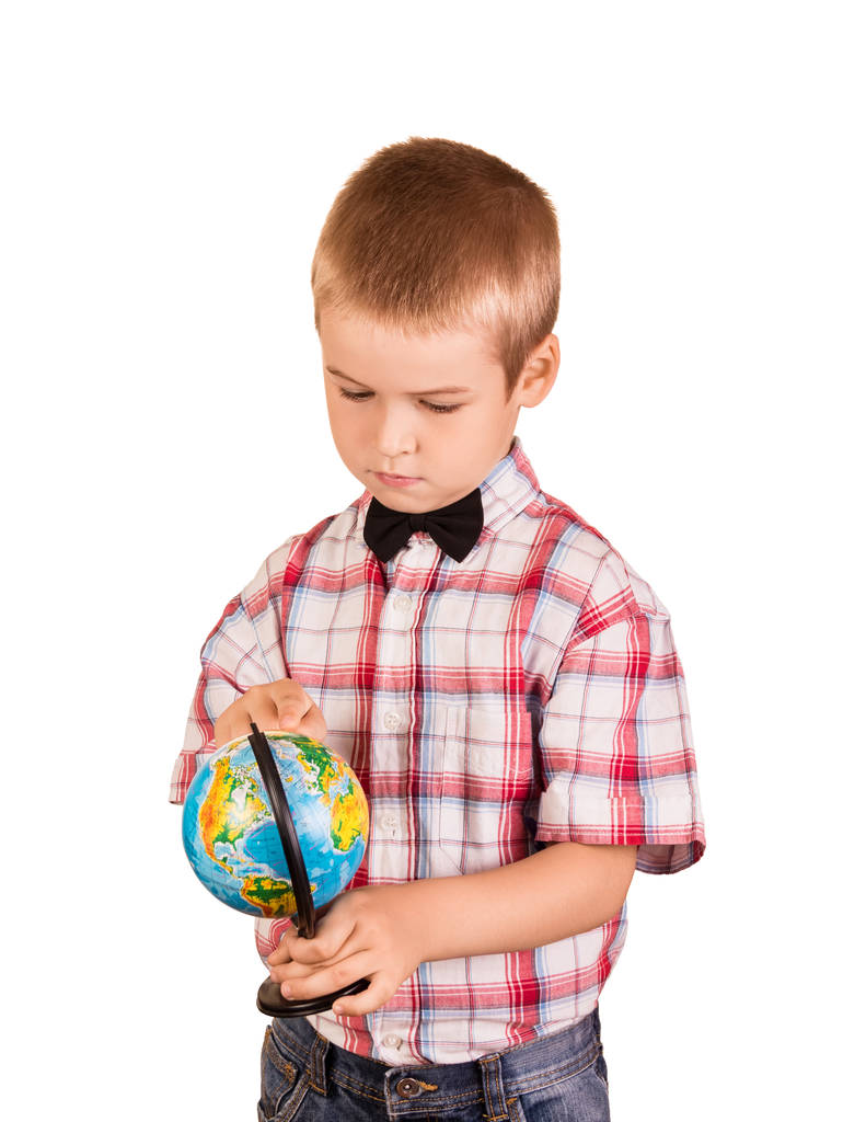 Schoolboy holds small globe in hands, isolated on white background - Photo, Image