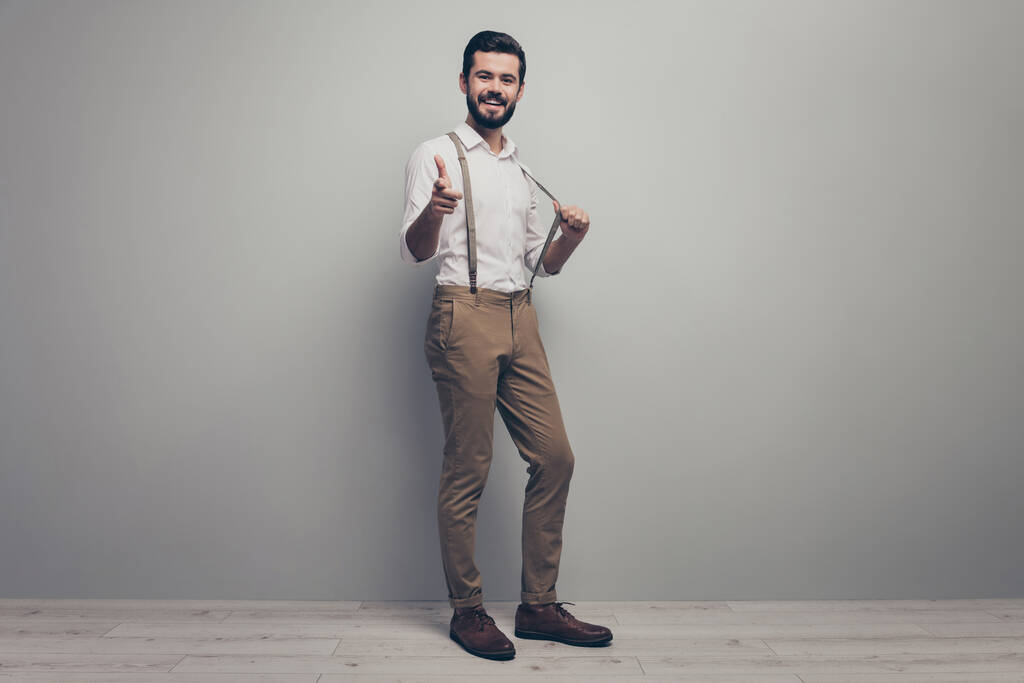Full size turned photo positive smart confident boss executive manager point index finger collar pull suspenders decide he will do report wear white pants trousers shoes isolated grey color background - Φωτογραφία, εικόνα