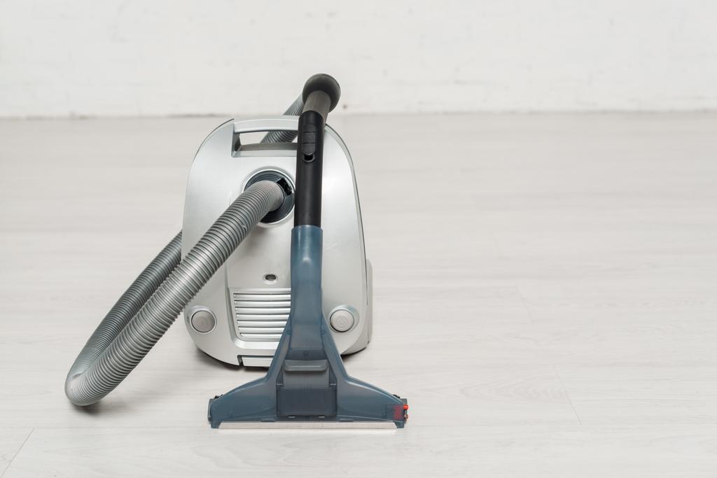 modern vacuum cleaner with handle on floor  - Photo, Image