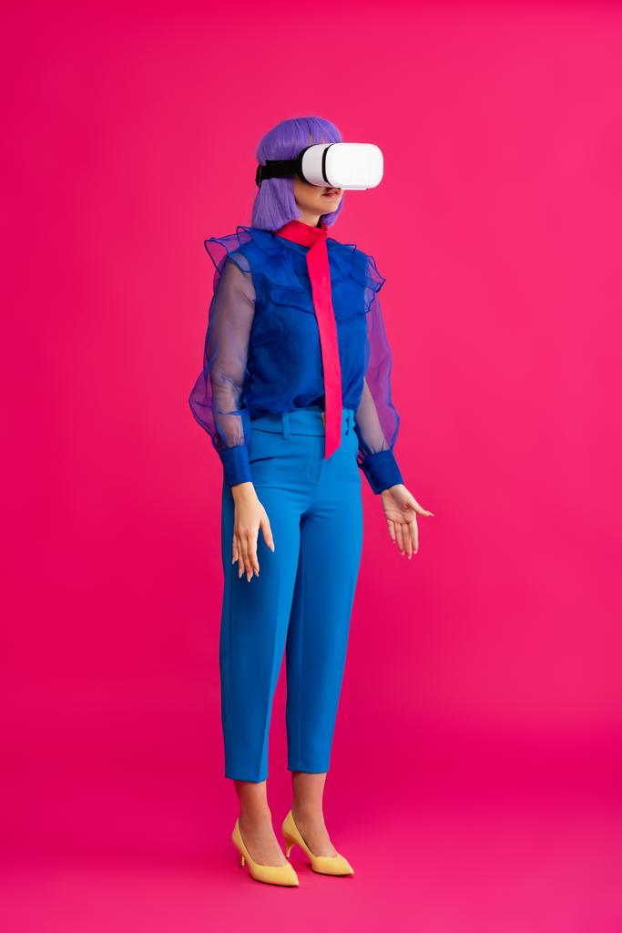 attractive pop art girl in blue fashionable blouse using virtual reality headset, on pink - Photo, Image