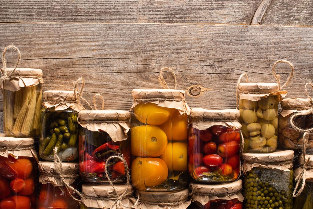 top view of delicious homemade tasty pickles on wooden rustic table - Photo, Image