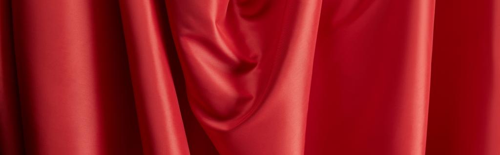 close up view of red soft and wavy silk textured cloth, panoramic shot - Photo, Image