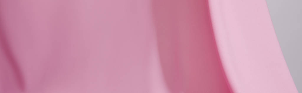 vista da vicino del morbido tessuto ondulato rosa isolato sul grigio, scatto panoramico
 - Foto, immagini