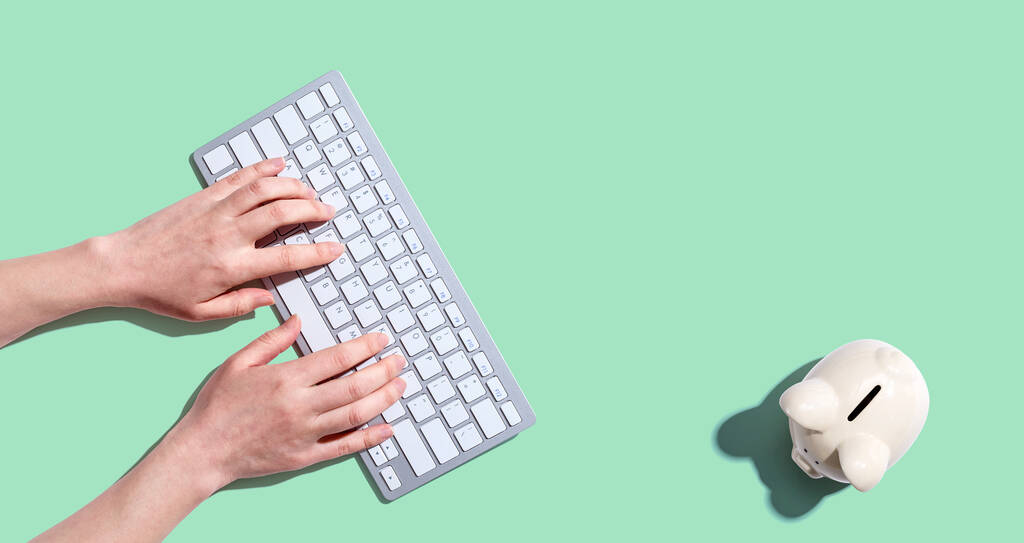 Woman using a computer keyboard - Photo, Image