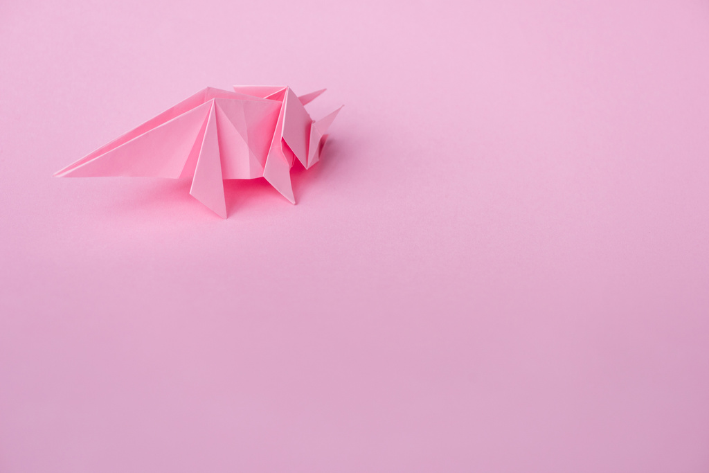 decorative origami rhinoceros on pink with copy space  - Photo, Image