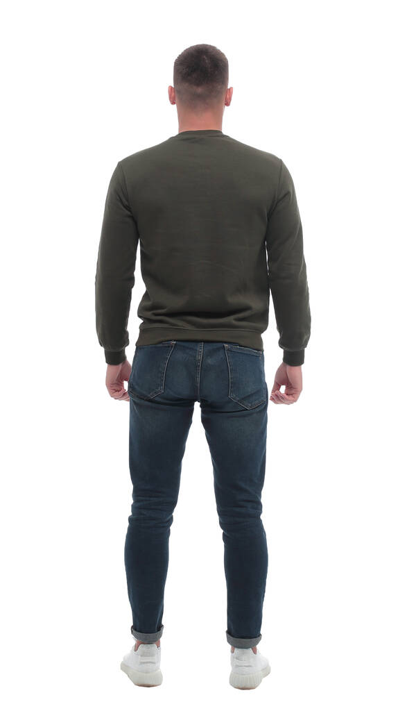 rear view. a young looking male standing in front of a blank white screen - Photo, Image