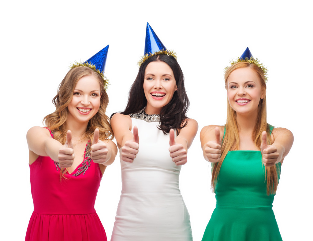 Three women wearing hats and showing thumbs up - Photo, Image