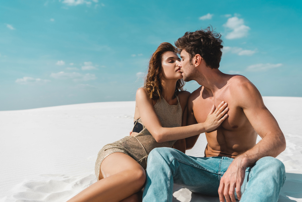 passionate sexy young couple kissing on beach  - Photo, Image
