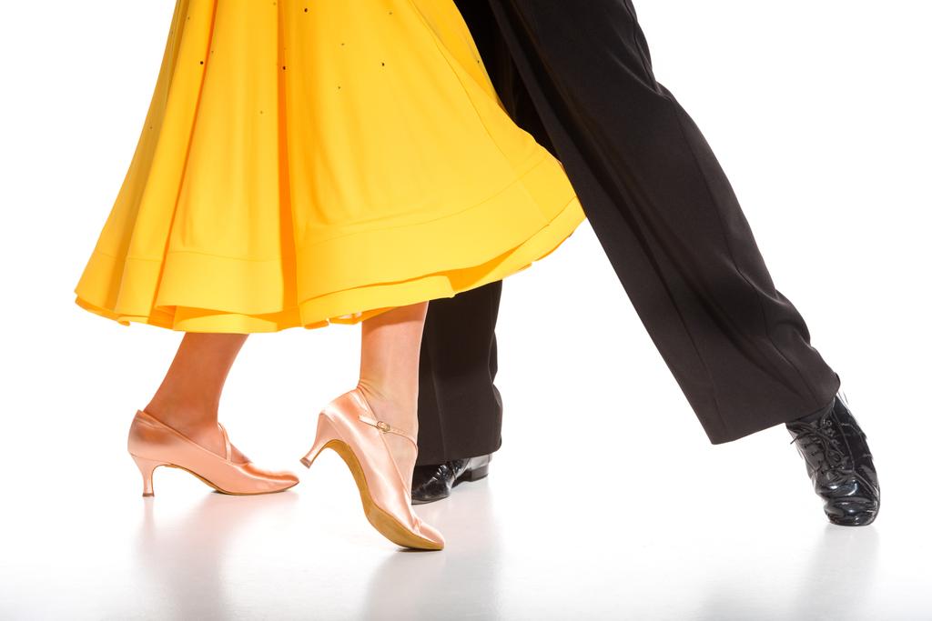 cropped view of elegant young couple of ballroom dancers dancing on white - Photo, Image