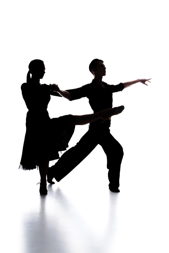 siluetas de elegante pareja de bailarines de salón bailando en blanco
 - Foto, Imagen