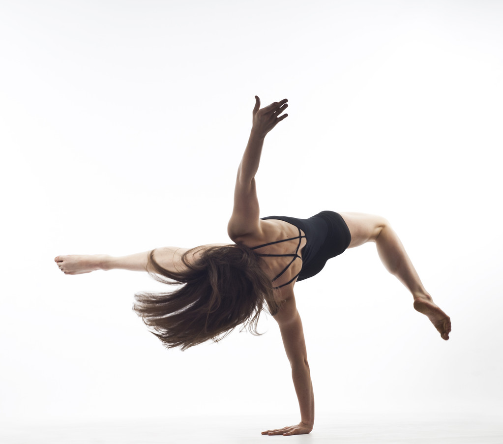 Chica gimnasta aislada en blanco
 - Foto, Imagen