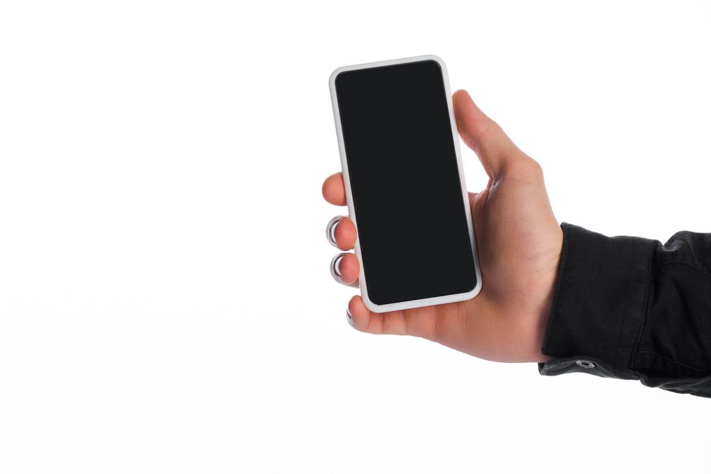 oříznutý pohled na člověka držícího smartphone s prázdnou obrazovkou izolovanou na bílé, evoluční koncept - Fotografie, Obrázek