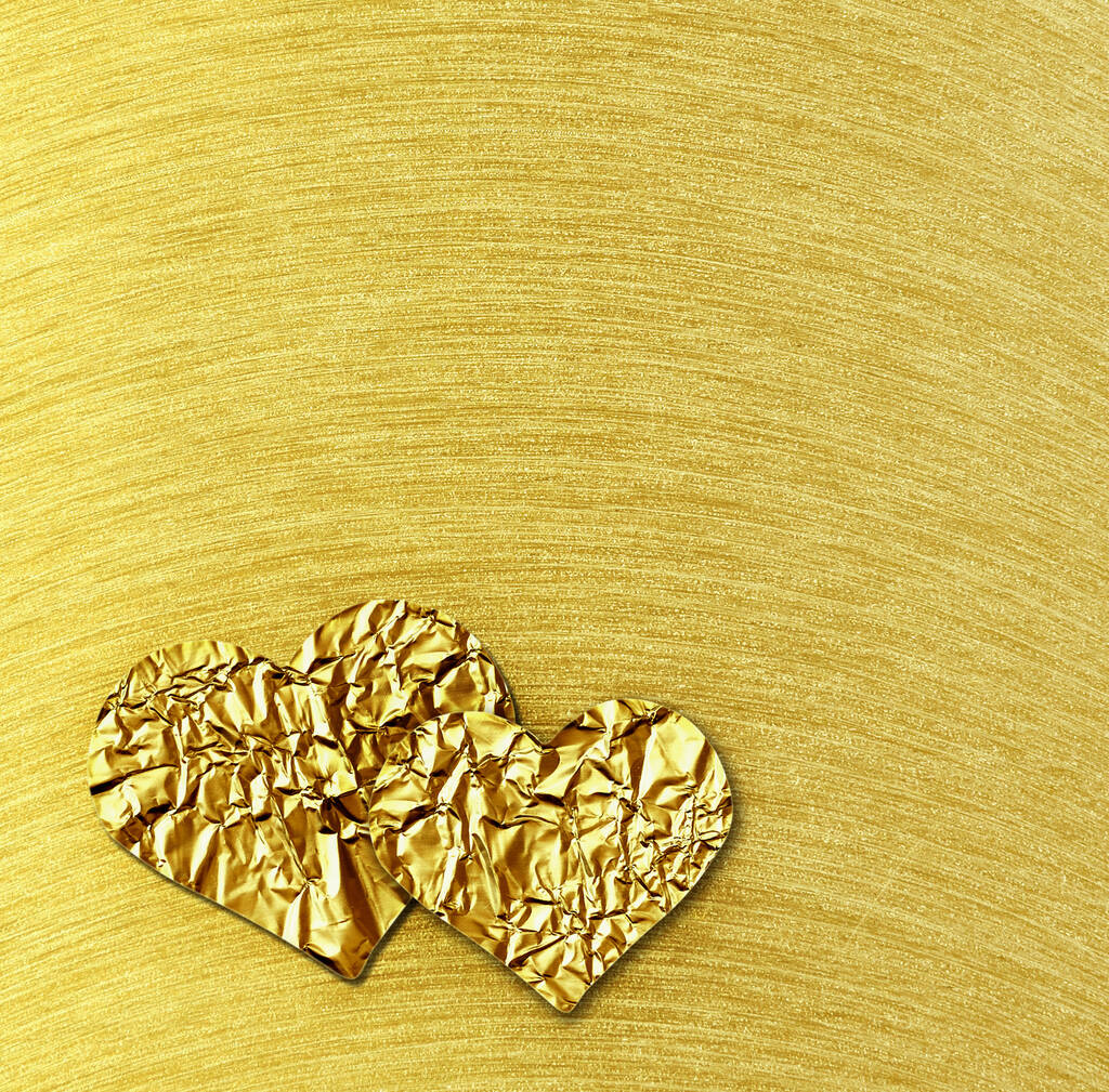 Deux cœurs dorés sur fond brossé en acier doré pour la Saint-Valentin
 - Photo, image