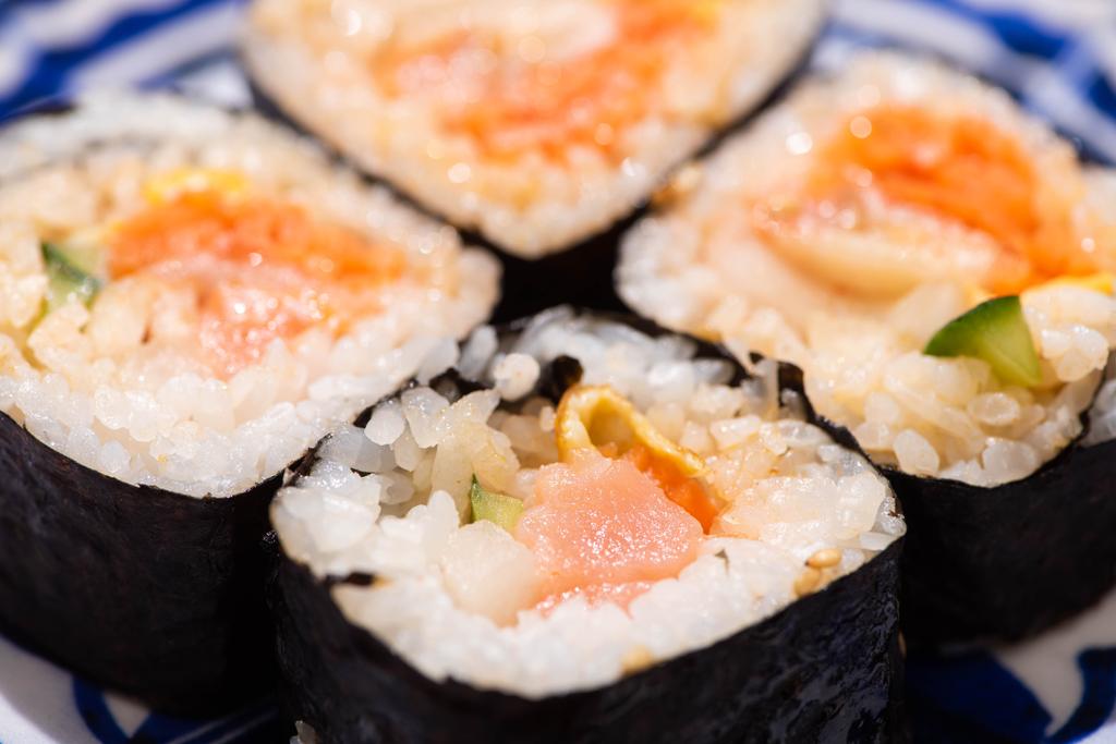 close up of fresh korean gimbap with vegetables and salmon  - Photo, Image