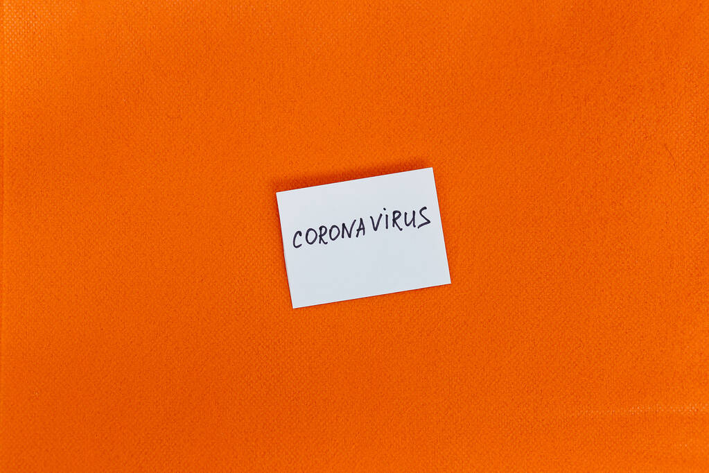 Abstract virus strain model of MERS-Cov or middle East respiratory syndrome coronavirus and Novel coronavirus 2019-nCoV with text on a background of orange spunbond. Pandemic Protection Concept - Photo, Image