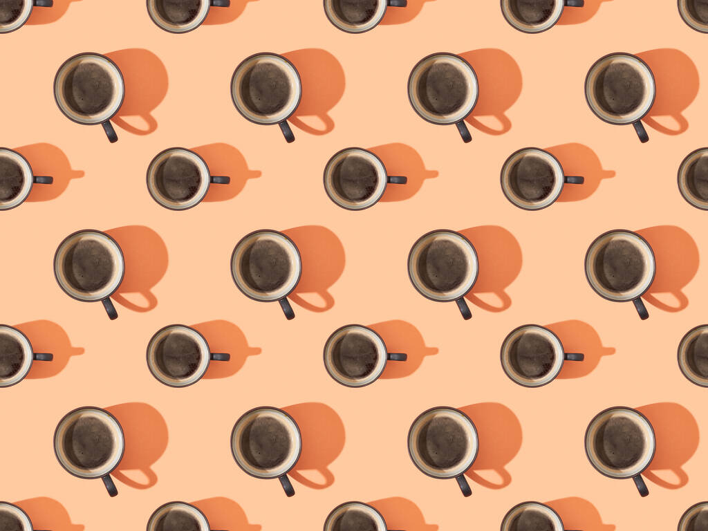vue de dessus des tasses de café frais sur orange, motif de fond sans couture
 - Photo, image