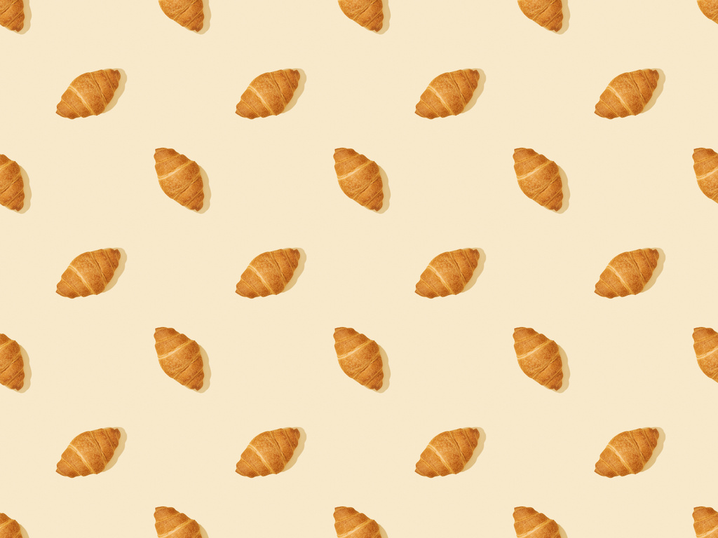 ylhäältä näkymä tuoreita croissanteja beige, saumaton tausta kuvio
 - Valokuva, kuva