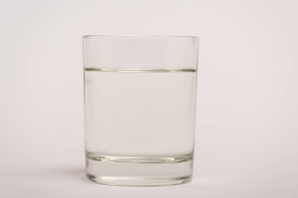 Close up view of glass of water on white surface - Photo, Image