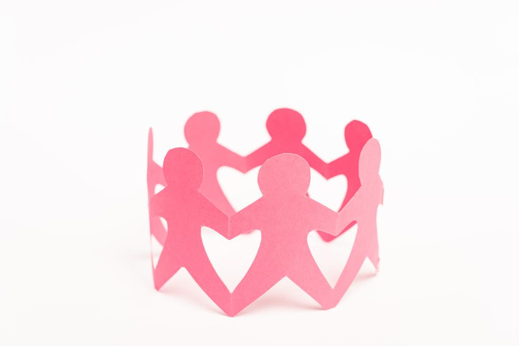 Figuras de papel rosa de personas cogidas de la mano sobre fondo blanco
 - Foto, Imagen