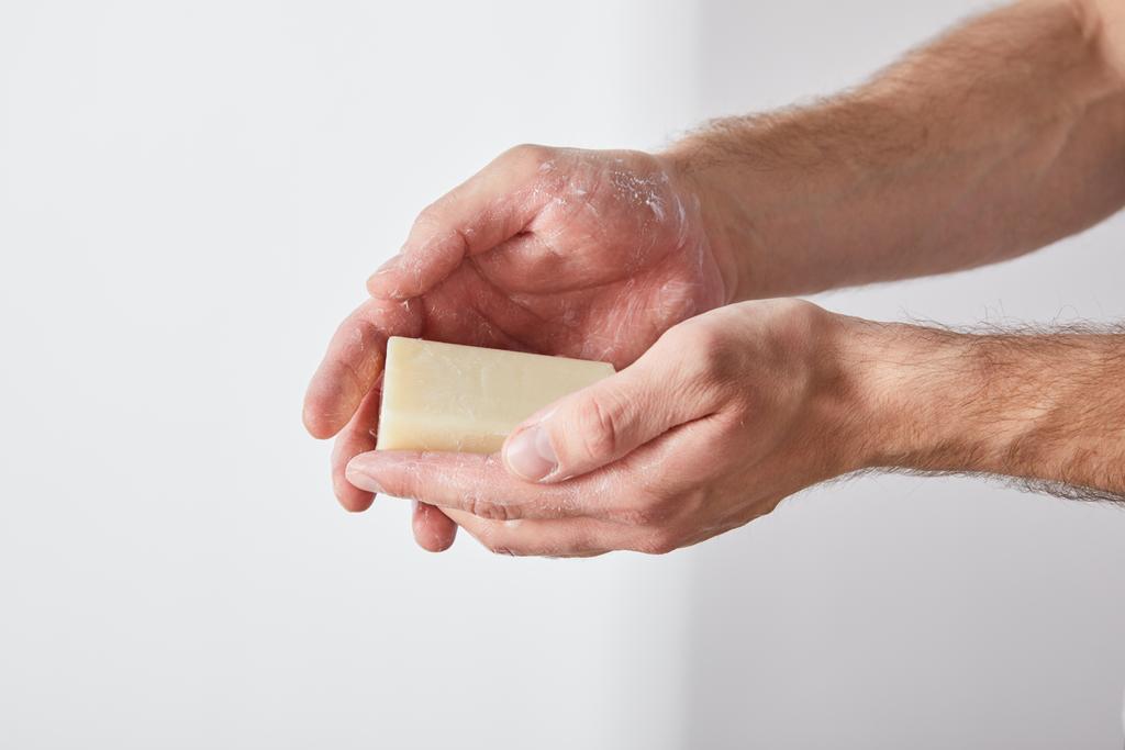 partial view of man using soap on grey background background - Photo, Image