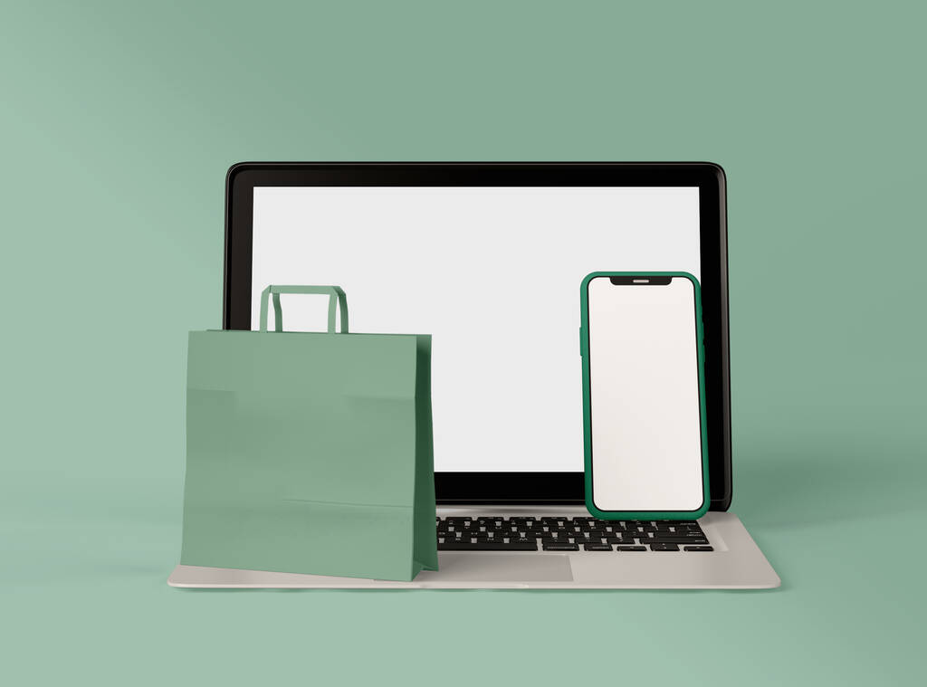 3D Illustration. Laptop ve beyaz ekranlı akıllı telefon ve kağıt alışveriş çantası. İnternetten alışveriş kavramı. - Fotoğraf, Görsel