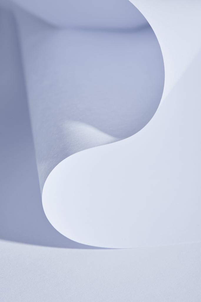 close up view of curved paper sheet on white background - Photo, Image