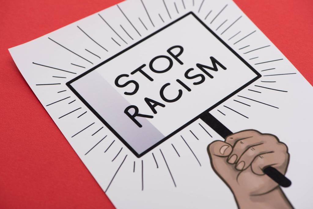 picture with drawn hand and stop racism placard on red background - Photo, Image