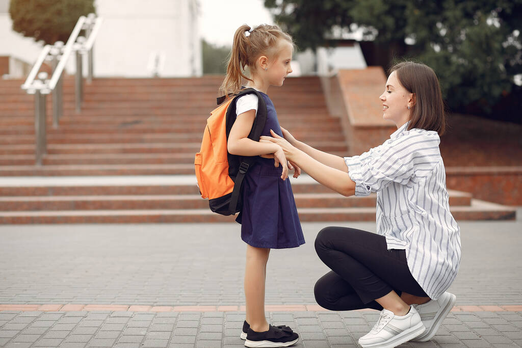 Mother prepare little daughter to school - Photo, Image